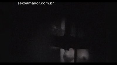 Blondie gets secretly videotaped by a neighborhood voyeur hidden behind hollow bricks